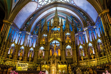 Fototapeta na wymiar Architectural detail of Notre-Dame Basilica, a basilica in the historic district of Old Montreal. Its dramatic interior is considered a masterpiece of Gothic Revival architecture