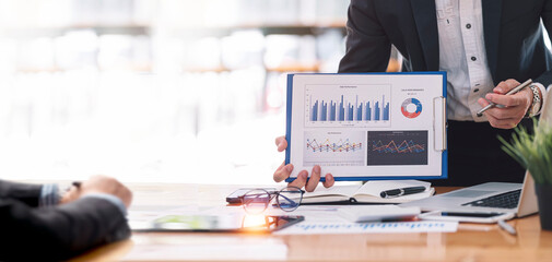 businessman working at office with document on his desk, doing planning analyzing the financial...