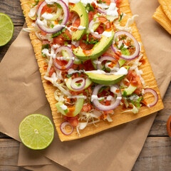 Snack made with wheat flour called chicharron preparado with sauce and vegetables. Mexican food