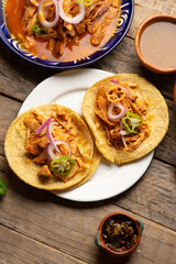 Cochinita pibil tacos with habanero pepper and purple onion. Mexican food