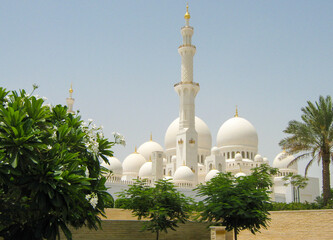 Abu Dhabi, UAE - June 2, 2013: View of the beautiful white Sheikh Zayed Mosque against the blue sky.