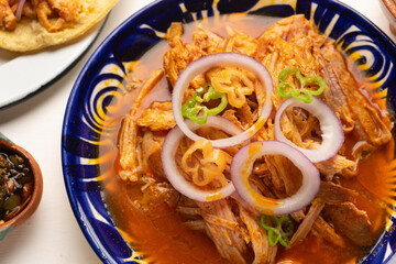 Cochinita pibil with habanero pepper and purple onion. Mexican food