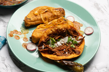 Beef birria tacos with sauce. Mexican food