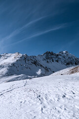 Fototapeta na wymiar Mountains. Blue clear sky in nice winter day. Caucasus, Elbrus region.
