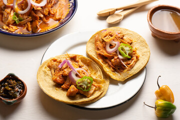 Cochinita pibil tacos with habanero pepper and purple onion. Mexican food