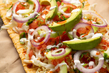 Snack made with wheat flour called chicharron preparado with sauce and vegetables. Mexican food
