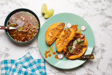 Beef birria tacos with sauce. Mexican food