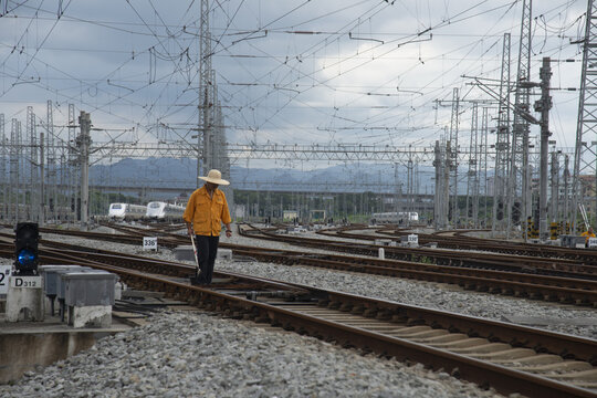 Railway station, railway and worker