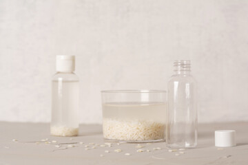 Jar of rice water for skin care face cleansing cosmetic product. Holistic beauty concept, fermented beauty care trend. Copy space