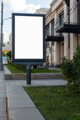 Fototapeta premium Vertical billboard on sidewalk. Monumental shopping center. Mock-up.