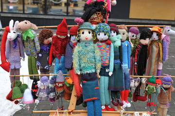 Colorful handmade knitted dolls. Close Up. Showcase at the fair