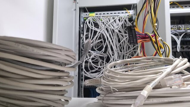 Network of many cables in local server room, motion forward shot