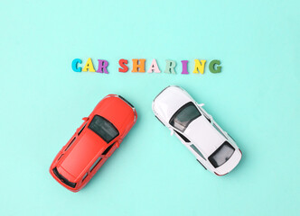 Car sharing concept. Two cars on a blue background with the word car sharing
