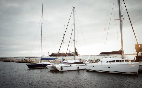 Many yachts in the yacht club at sea at sunrise