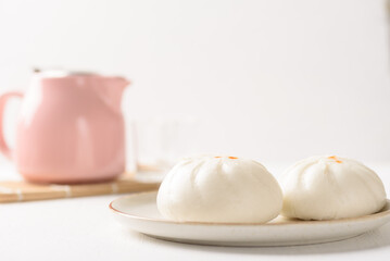 Fototapeta na wymiar Steamed Chinese bun on white background, a popular Asian street food