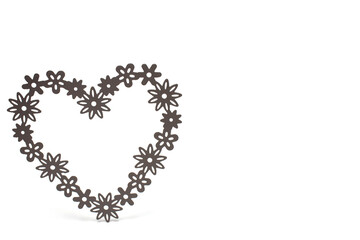 Closeup heart filigree shapes white background concept