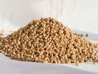 A bunch of dry yellow peas. Close-up of dry green peas. Green Pea Seeds for healthy vegetarian food with high nutrient content