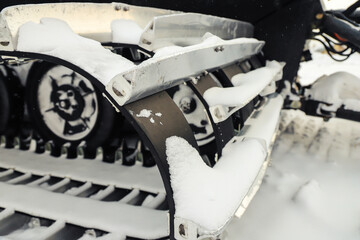 Detail of snowcat crawler close-up. Winter, snow, outdoors