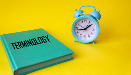 Notepad with text TERMINOLOGY on yellow background. Business concept.