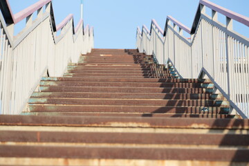 concrete staircase with steel railings