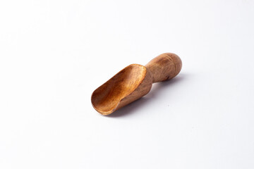 Wooden spoon on white background