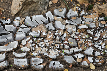 Grey dried and cracked ground earth background. Closeup of dry fissure dark ground. erosion. High...
