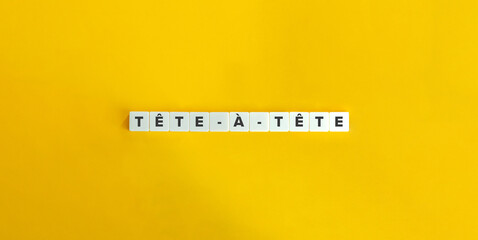 Tête-à-tête (face-to-face) Expression in French on Letter Tiles on Yellow Background. Minimal...