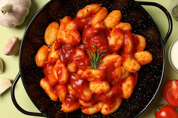 Concept of tasty food with potato gnocchi, top view