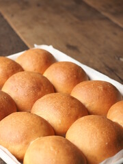 Thai milk tea bread rolls in baking tray