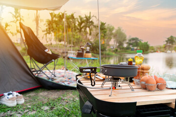 Cooking food during camping at natural park in Thailand. Recreation and journey outdoor activity...