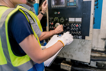 Industrial factory concept. Engineering with technician and worker operating and maintenance of machinery.