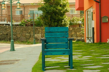 Fototapeta na wymiar The chair standing alone in the street
