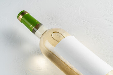 bottle of white wine on a white background. wine bottle with blank label mockup