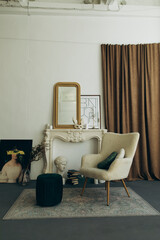 boucle chair with cushions on a vintage carpet in the room. room interior with vintage armchair,...