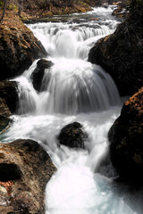 Fototapeta premium 北海道伊達市、雪解け水で迫力のある春の三階滝【4月】