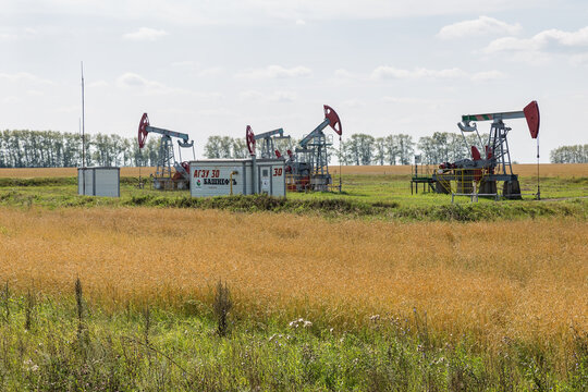 Ufa, Bashkortostan, Russia - August 20, 2018: Oil pumpjack in the field. Oil well industry. Bashneft