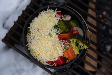 Cooking by the fireplace in winter