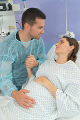 man supporting his partner through childbirth