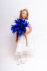 Pretty young kid girl with blue flower