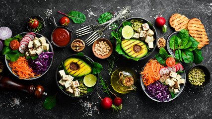 Healthy vegetarian eating, super food. The concept of healthy eating. On a black stone background....