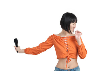 Young asian woman recoiling from a loud sound with microphone, isolated on white background.