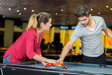 couple playing billiards and bonding