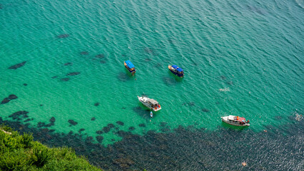 Yachts stand in a bay with azure water near Cape Fiolent