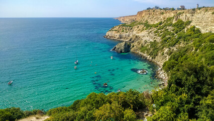 Yachts stand in a bay with azure water near Cape Fiolent