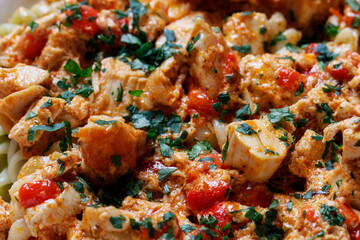 Pasta with beef and vegetables in a large saucepan.