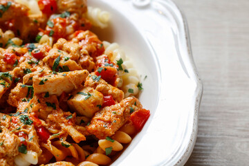 Pasta with beef and vegetables in a large saucepan.