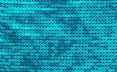 Fabric with sequins as a background. Glittery texture is the trend of the season. Sparkling color holographic blue, pink.