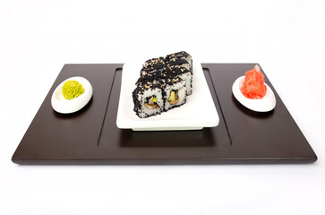 Sushi rolls Japanese delicacies. Japanese traditional rice and fish dishes. Beautiful serving food on a light background with copy space. A set of delicious goodies.