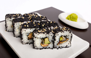 Sushi rolls Japanese delicacies. Japanese traditional rice and fish dishes. Beautiful serving food on a light background with copy space. A set of delicious goodies.