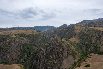 Obraz premium Beautiful river canyon with rocks and bushes. Nature background. Colorful scenery. Assy river canyon